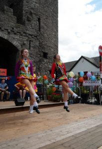 Shows dancers in front of #MusicAtTheGate